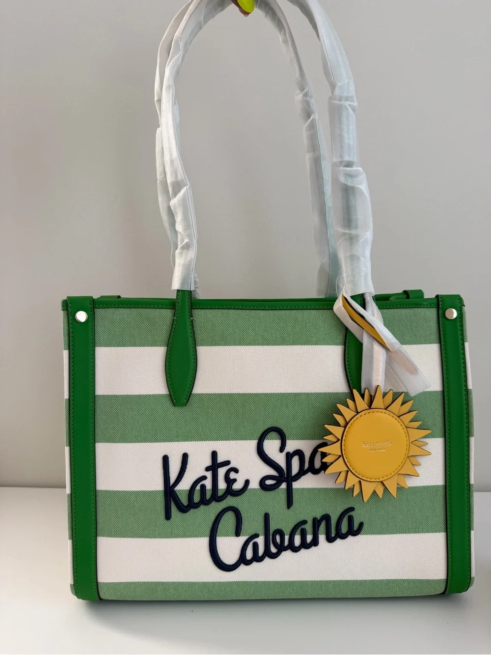 kate spade Green and White Striped Cabana Tote with Yellow Sun Charm